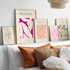 Matisse Art Prints - Pink Abstract Nude Figure Art Print displayed on a wall with modern decor and vibrant colors.