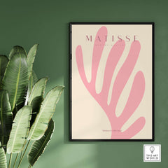 Matisse Art Prints -    Pink Coral Leaf Abstract Botanical Poster displayed in a minimalist setting with lush green leaves.
