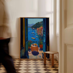 Matisse Portofino Balcony Art Print | Italian Harbour Village Poster displayed near a wooden chair in an elegant interior.