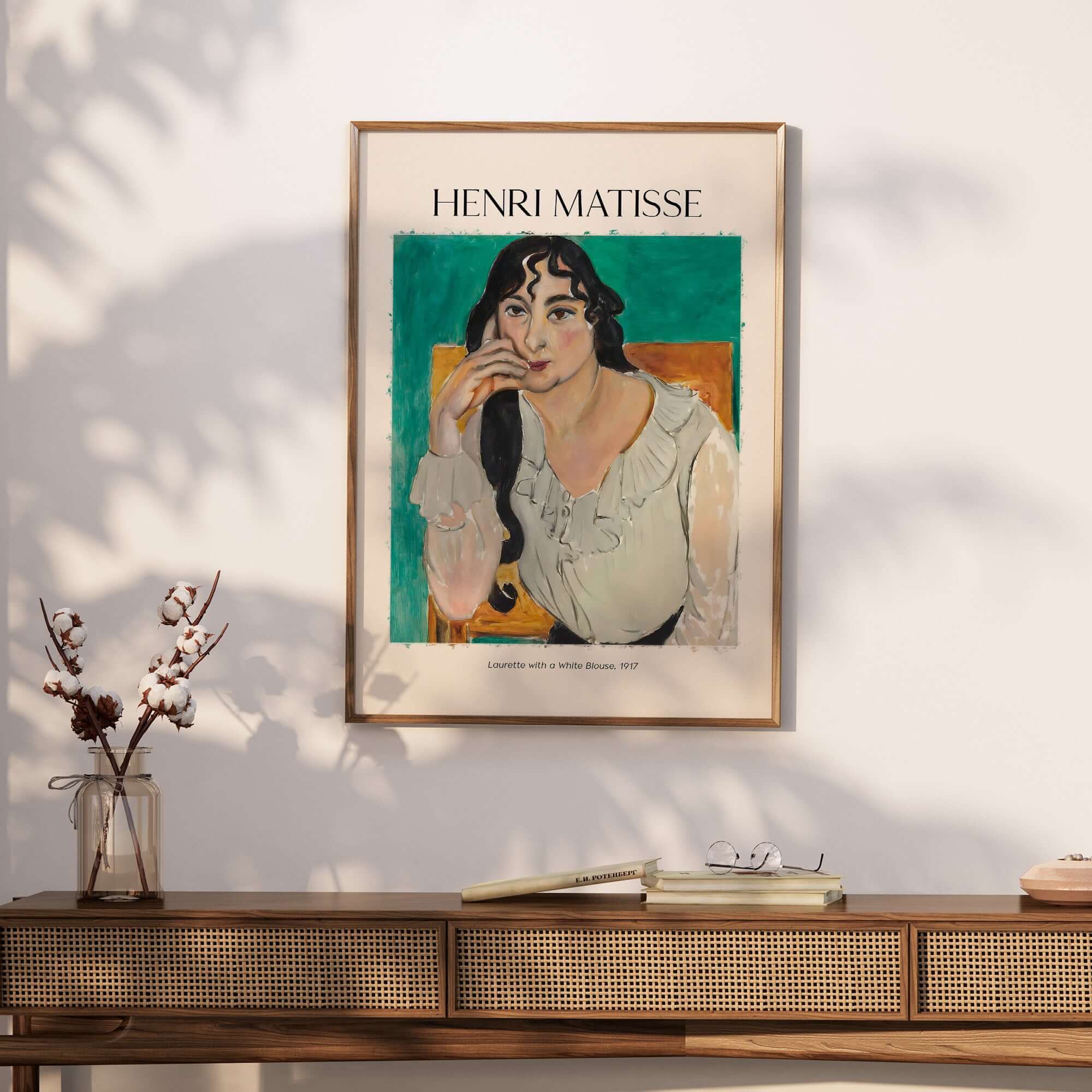 Matisse Poster  - Laurette with a White Blouse 1917 Art Print displayed on a wall with a wooden console.