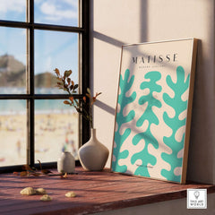 Matisse Art Prints - Teal Coral Pattern Abstract Wall Art displayed in sunlight near a window with a coastal view.