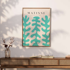 Matisse Art Prints - Teal Coral Pattern Abstract Wall Art displayed in a modern interior setting on a wooden table.