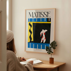 Matisse Art Print - The Clown 1943 Jazz Series Abstract Figure Poster displayed in a cozy room.