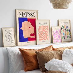 Matisse The Wolf 1947 Papiers Découpés Poster Print displayed among abstract art prints on a modern shelf.