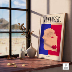 Matisse The Wolf 1947 Papiers Découpés Poster Print displayed in a modern interior setting with beach view.