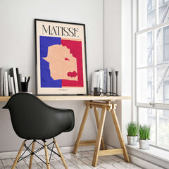 Matisse The Wolf 1947 Papiers Découpés Poster Print displayed in a modern home office with a stylish chair.