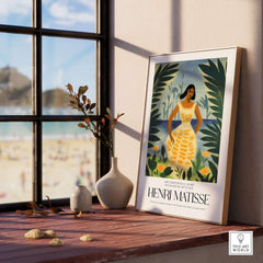 Matisse Art Prints - Woman Tropical Leaves Art Print displayed in a bright room with a beach view.