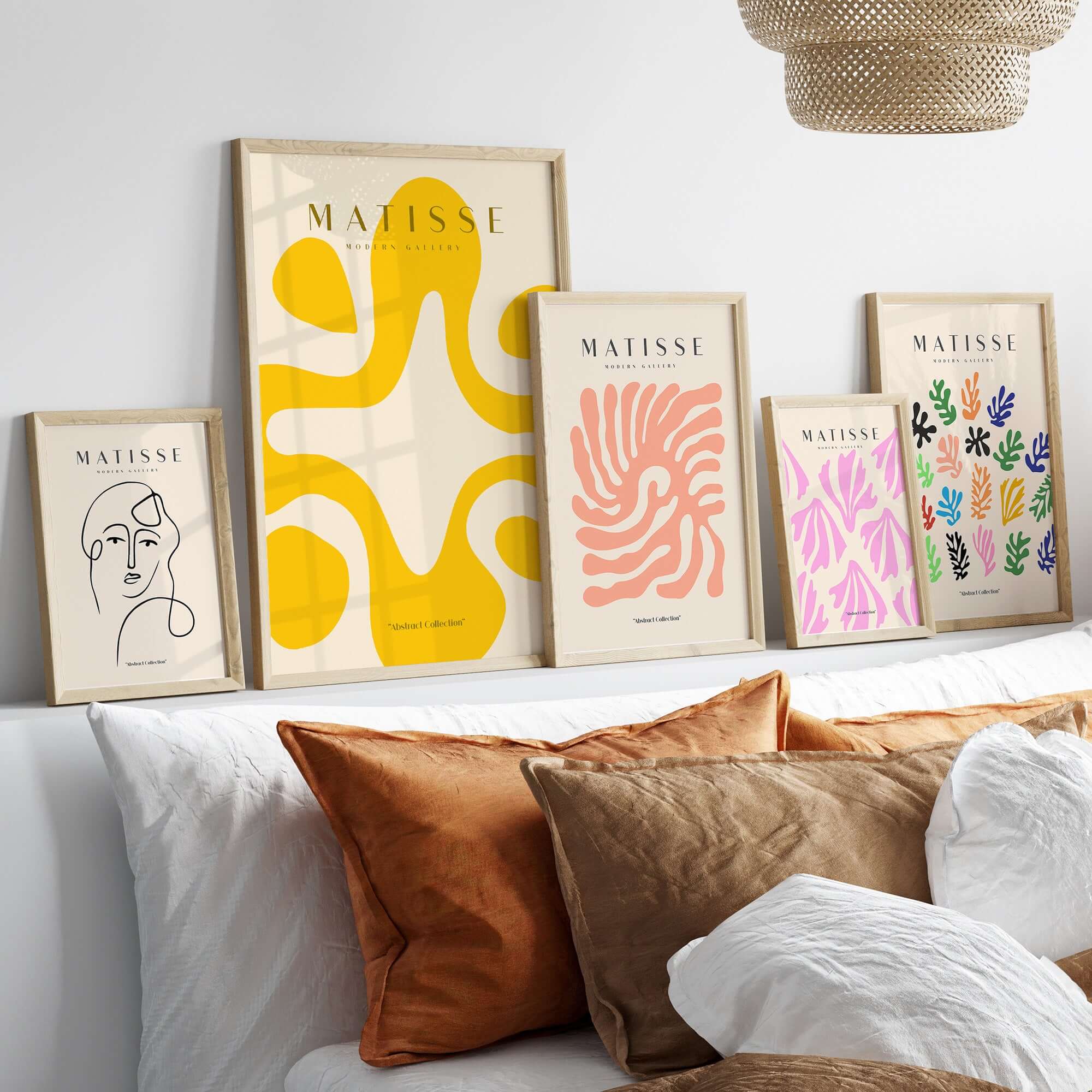 Matisse Art Prints - Yellow Abstract Fluid Shape Poster displayed on wall among other framed artworks in a modern setting.