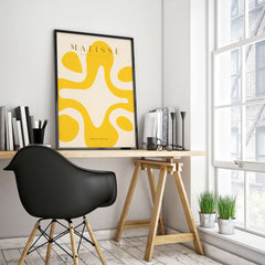 Matisse Art Prints -   Yellow Abstract Fluid Shape Poster displayed in a modern workspace environment, enhancing the interior decor.
