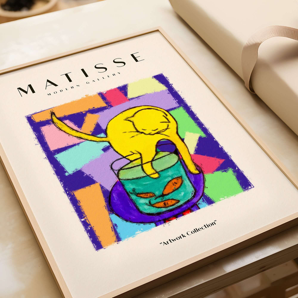 Matisse Art Prints - Yellow Cat with Fishbowl Geometric Poster displayed in a stylish frame on a table.
