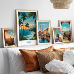 Maui Canvas Print | Hawaii Poster displayed among framed travel artwork on a stylish sofa.