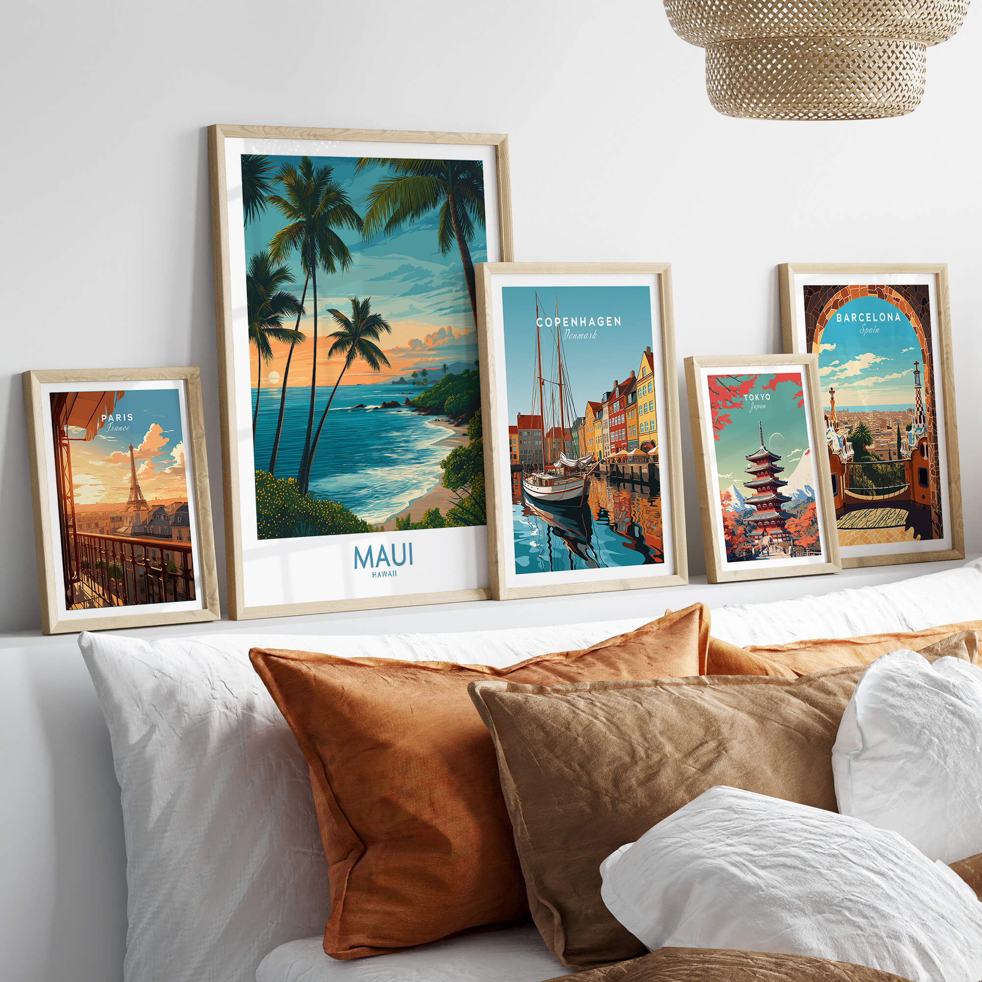 Maui Canvas Print | Hawaii Poster displayed among framed travel artwork on a stylish sofa.