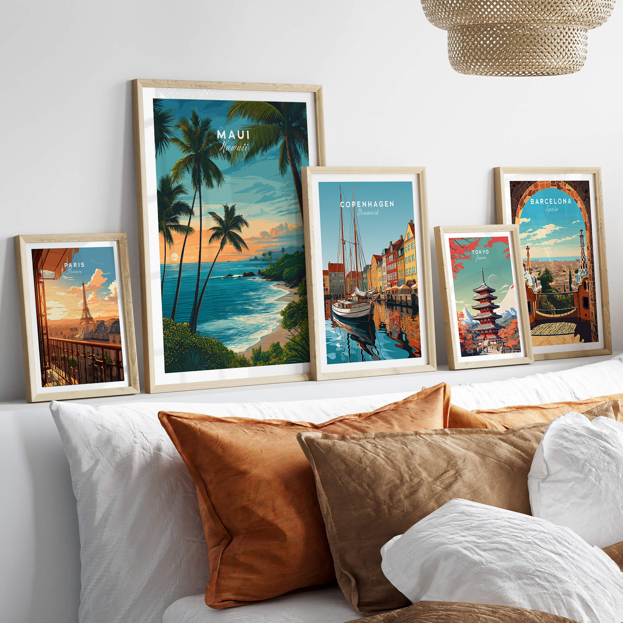 Maui Hawaii Travel Poster | Scenic Tropical Bay View Wall Art Print displayed among other travel posters on a stylish sofa.