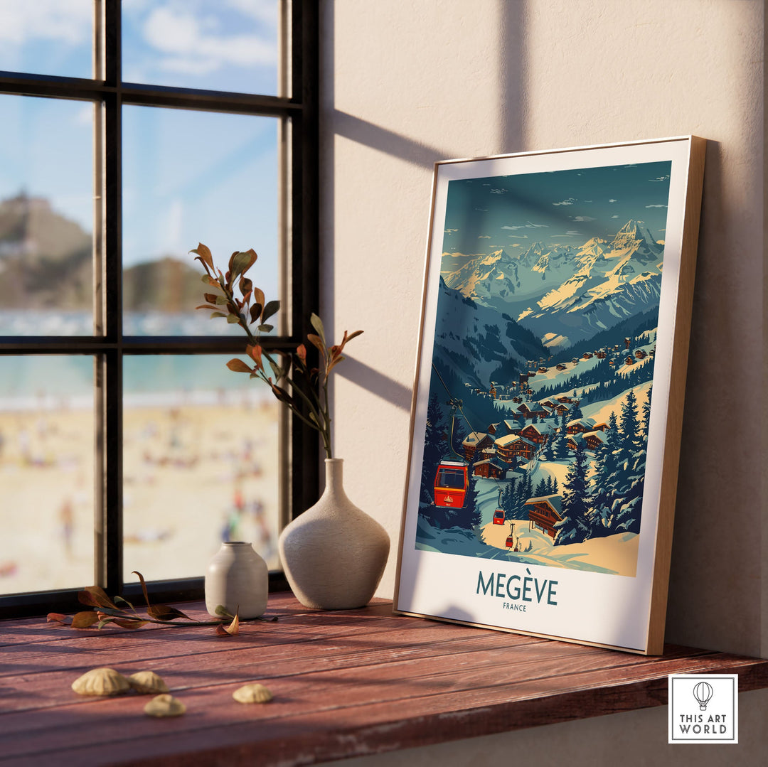 Megève poster featuring a scenic ski resort in France, displayed on a sunlit windowsill with decorative vases nearby.