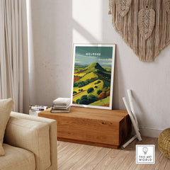 Melrose Scotland Eildon Hills Travel Print Poster Scottish Landscape Wall Art displayed in a cozy interior setting.