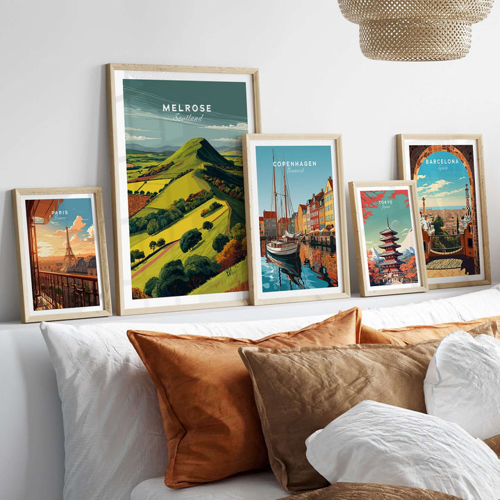 Melrose Scotland travel print posters showcased in stylish frames on a wall, highlighting scenic landscapes and cityscapes.