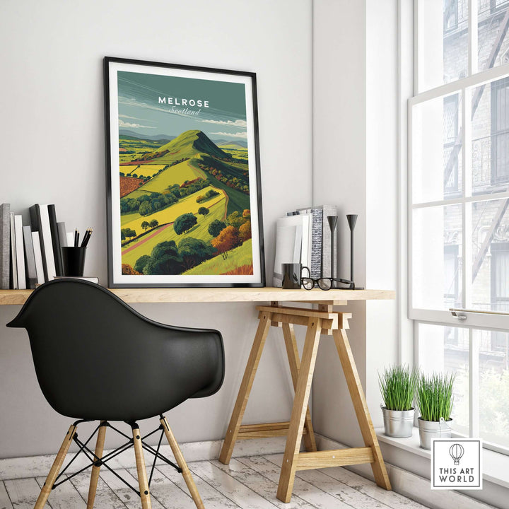 Melrose Eildon Hills travel print poster hanging in a stylish office, showcasing Scottish landscape wall art.