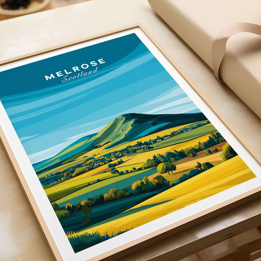 Melrose Scotland travel poster print featuring Eildon Hills and vibrant landscape in yellow and green under a blue sky.