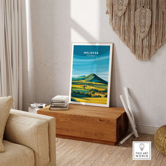Melrose Scotland Travel Poster Graphic Landscape Print Eildon Hills Wall Art Decor displayed in a modern living room.