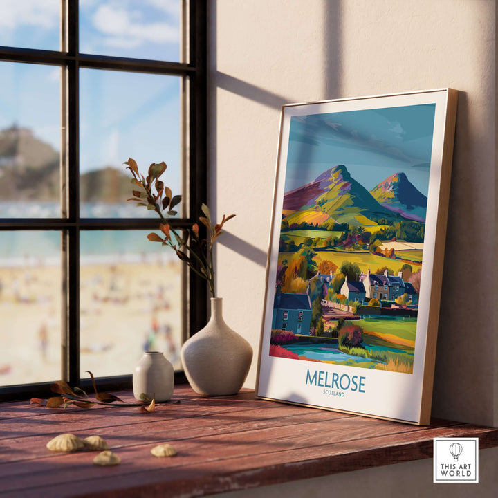 Scottish Borders Melrose travel poster featuring Eildon Hills and village scenery in colorful illustration design.