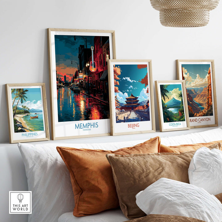 Vibrant travel posters displayed on a shelf, featuring Memphis, Beijing, Costa Rica, Grand Canyon, and Philippines artworks.