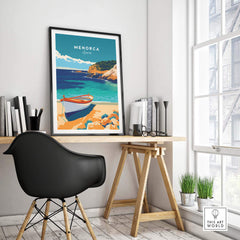 Menorca Travel Poster displayed on a desk with a black chair, showcasing a scenic view of Menorca's coastline.