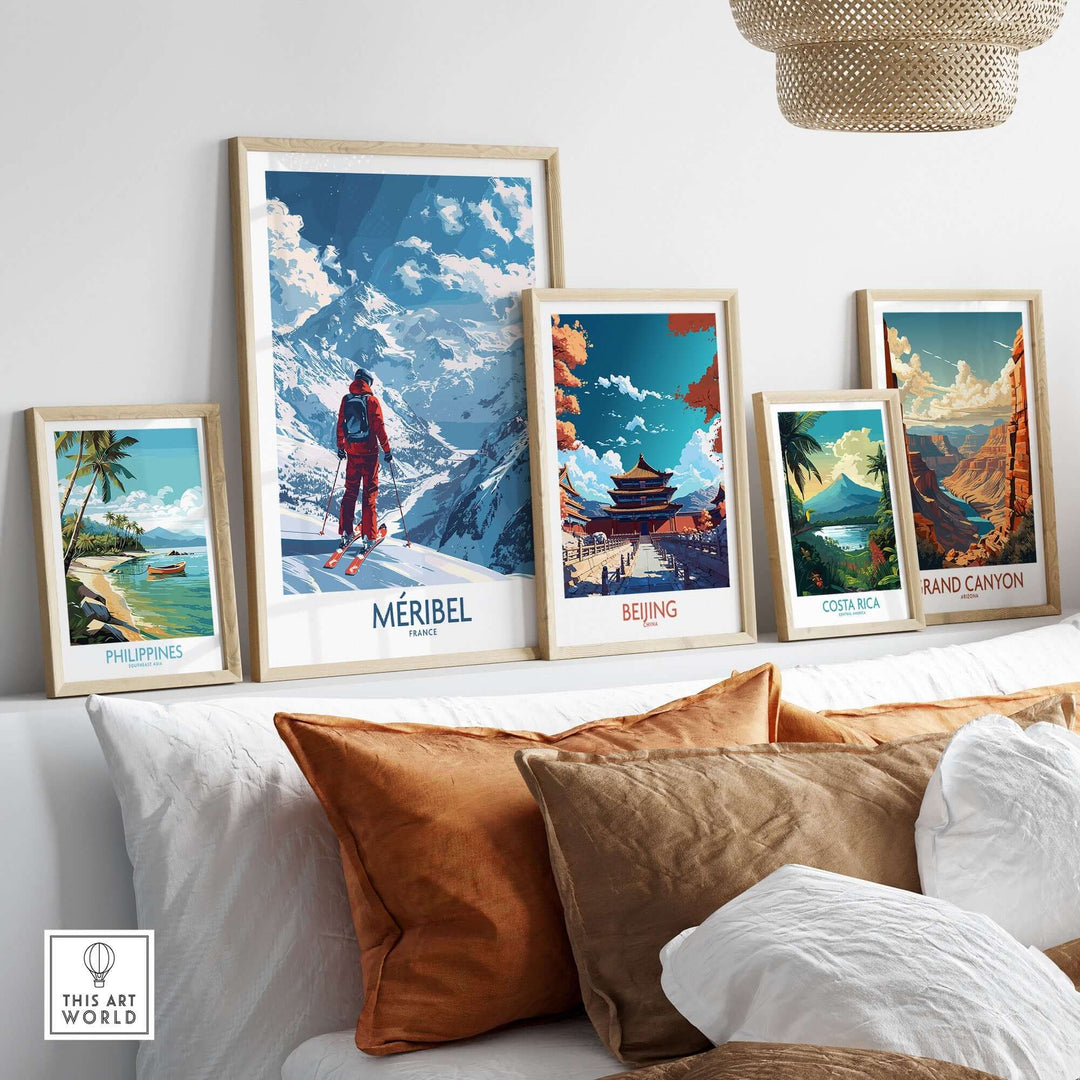 Meribel Ski Print and travel art posters displayed in frames on a stylish wall above a cozy couch.