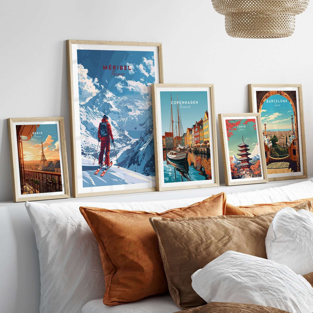 Ski-themed travel posters, including Meribel, displayed stylishly on a wall above a cozy bed with decorative pillows.