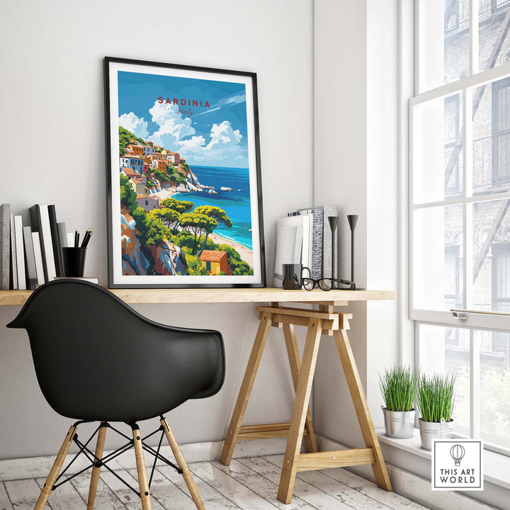 Modern Sardinia poster showcasing Italy's scenic landscape on a desk in a stylish room with a black chair and large window