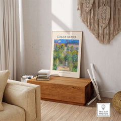 Monet Artists Garden at Vétheuil Sunflowers Impressionist Art Print Poster displayed in a stylish living room setting.
