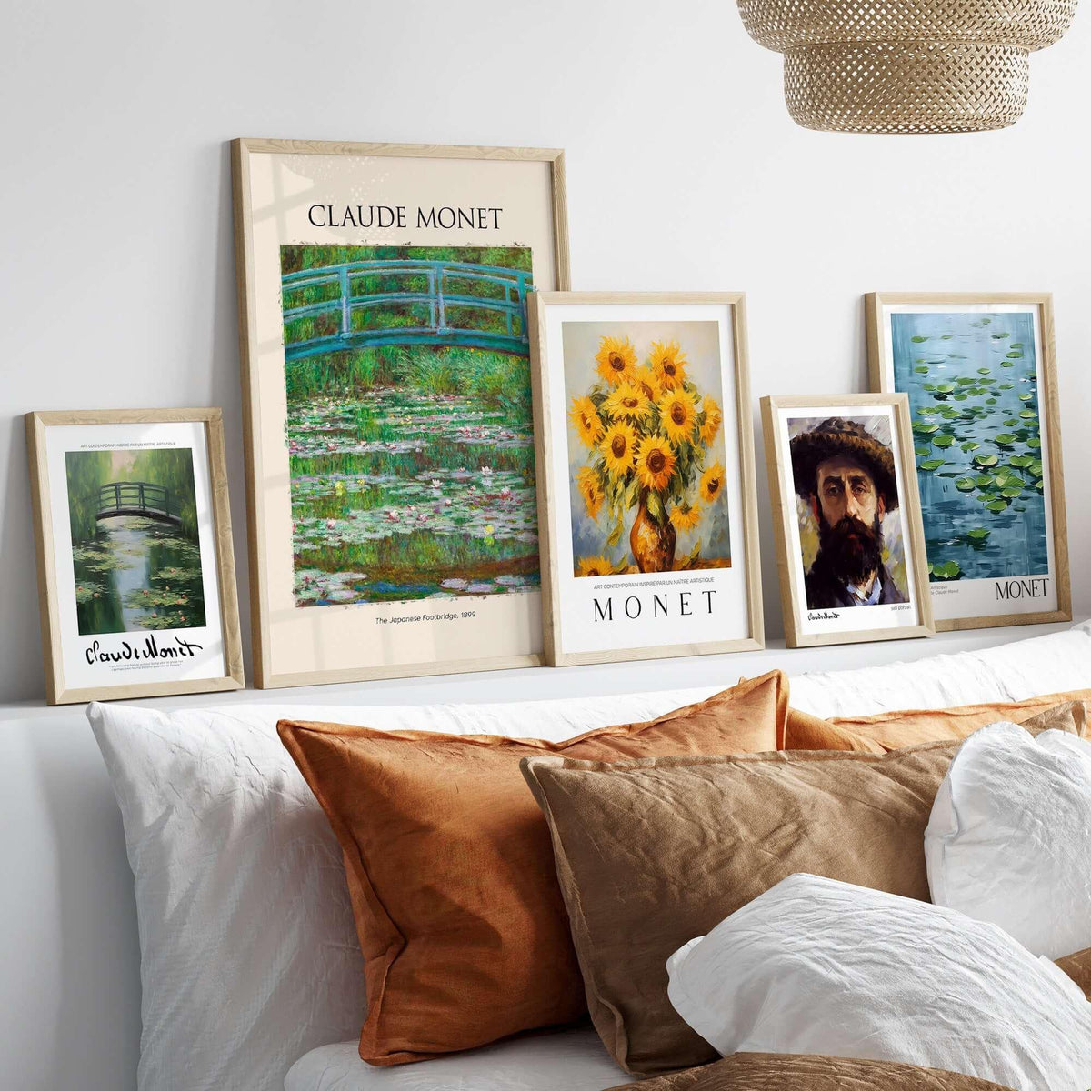 Monet Japanese Footbridge Water Lilies Giverny Garden Poster Art Print displayed with other Monet artworks in a cozy interior.