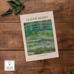 Monet Japanese Footbridge Water Lilies Giverny Garden Poster Art Print displayed on wooden surface with water lilies.
