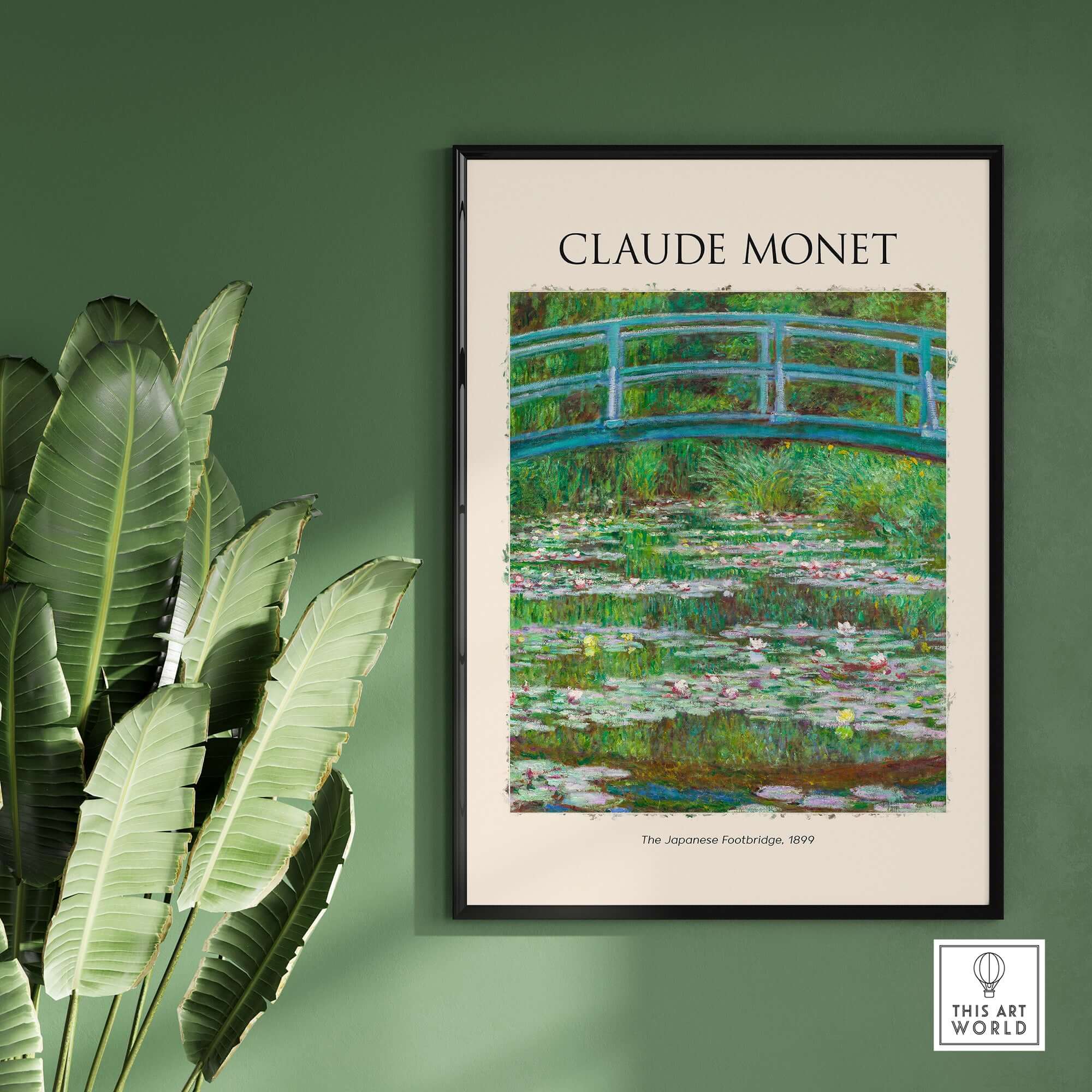 Monet Japanese Footbridge Water Lilies Giverny Garden Poster Art Print framed on a green wall with tropical plants.