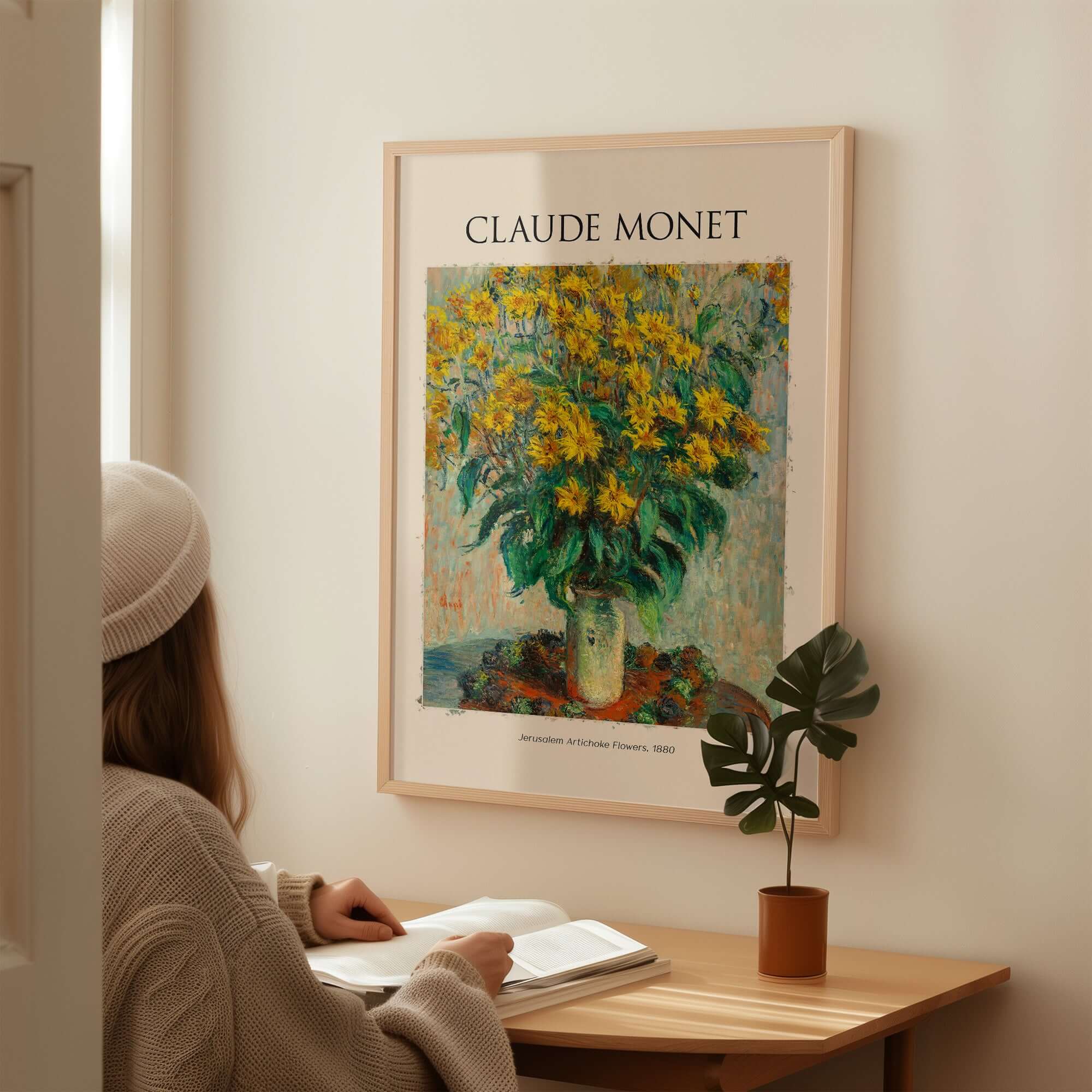 Monet Jerusalem Artichoke Flowers Still Life Floral Art Print Poster displayed on wall with woman studying nearby.
