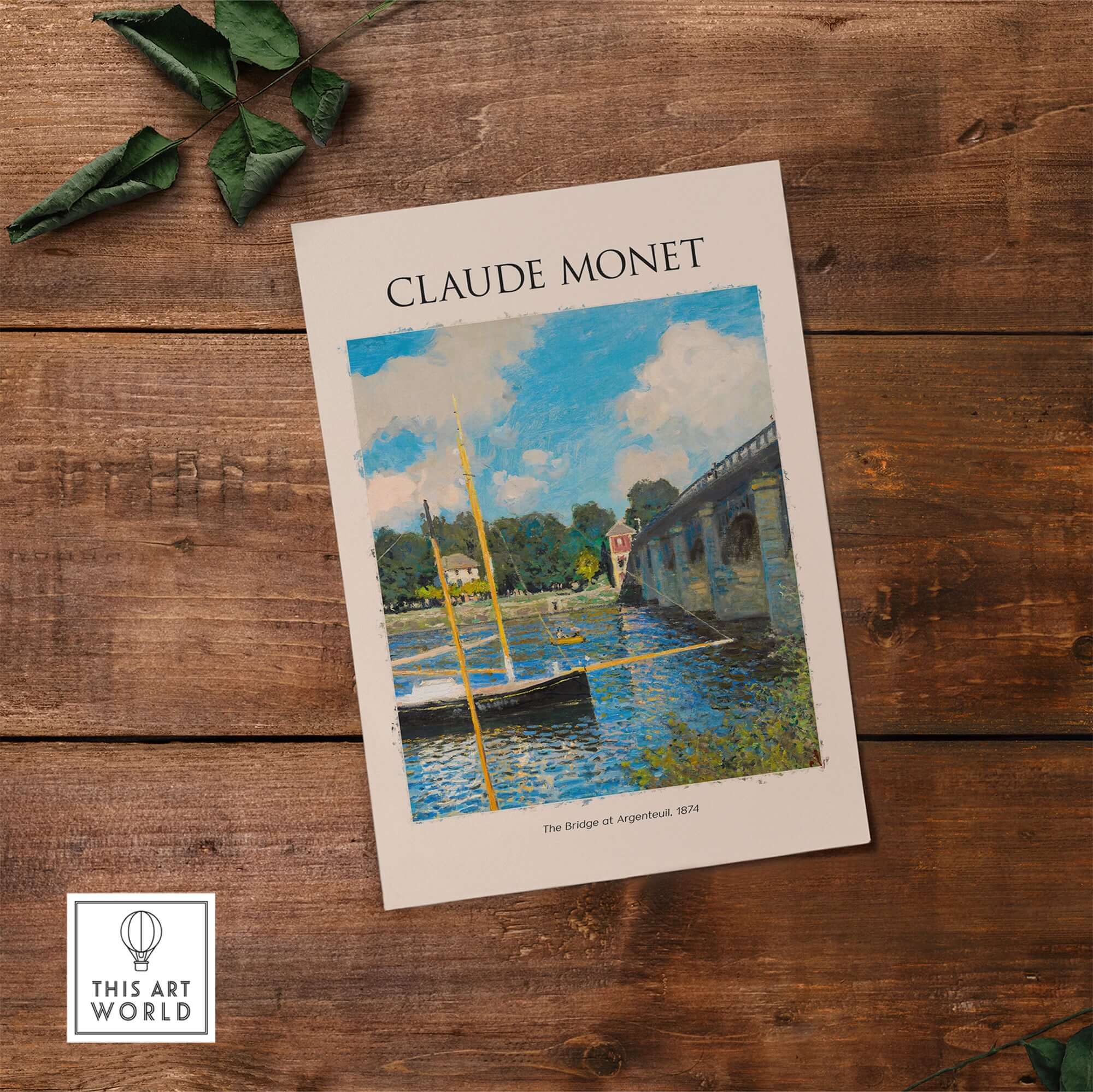 Monet The Bridge at Argenteuil Seine River Landscape Art Print Poster on wooden table.