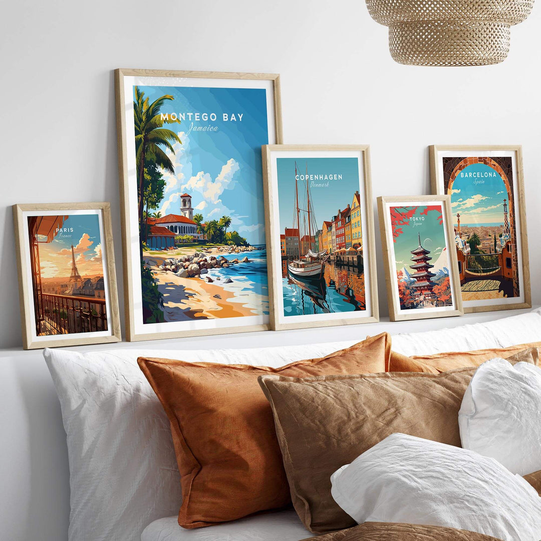 Montego Bay travel print displayed among framed artworks of various cities on a stylish bed.