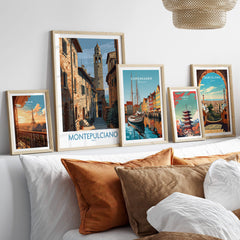 Montepulciano Italy Poster | Tuscany Canvas Print displayed among travel-themed art frames on a cozy couch.