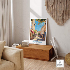 Montpellier Travel Poster displayed in a cozy living room setting with warm tones and natural light.