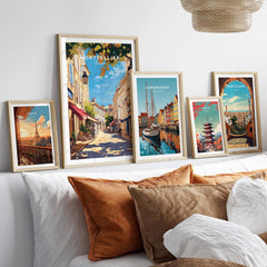 Montpellier Travel Print displayed alongside travel prints of Copenhagen and Barcelona in a cozy living room setting.