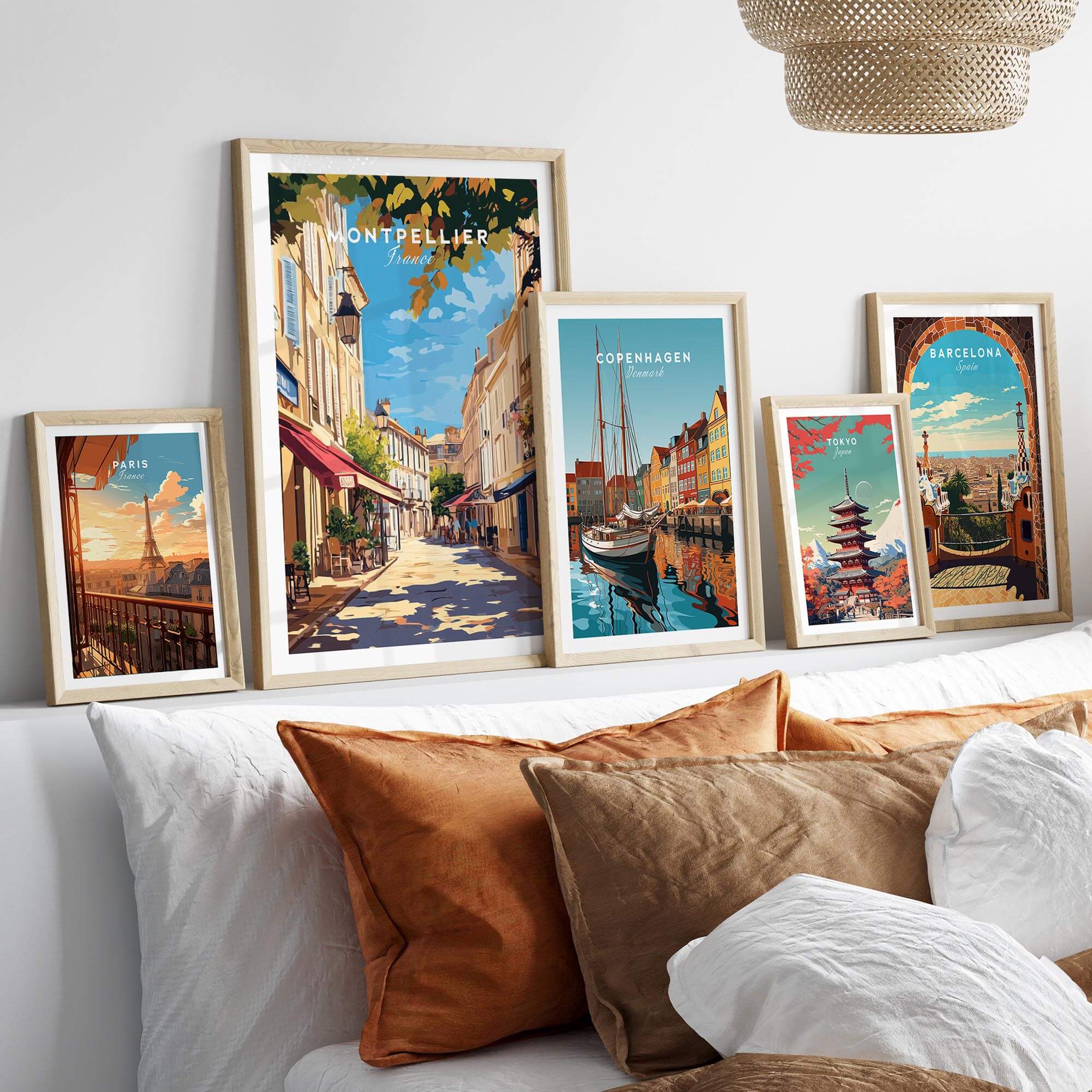 Montpellier Travel Print displayed alongside travel prints of Copenhagen and Barcelona in a cozy living room setting.