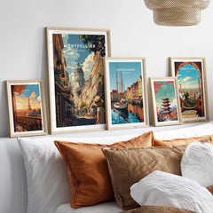 Montpellier Wall Art displayed on a wall among framed travel prints, enhancing home decor with vibrant colors.