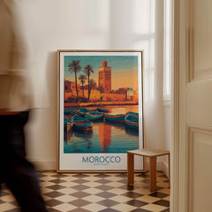 Morocco Canvas Print | Traditional Blue Boat & Port Poster featuring a coastal scene with fishing boats and the tower in sunset colors.
