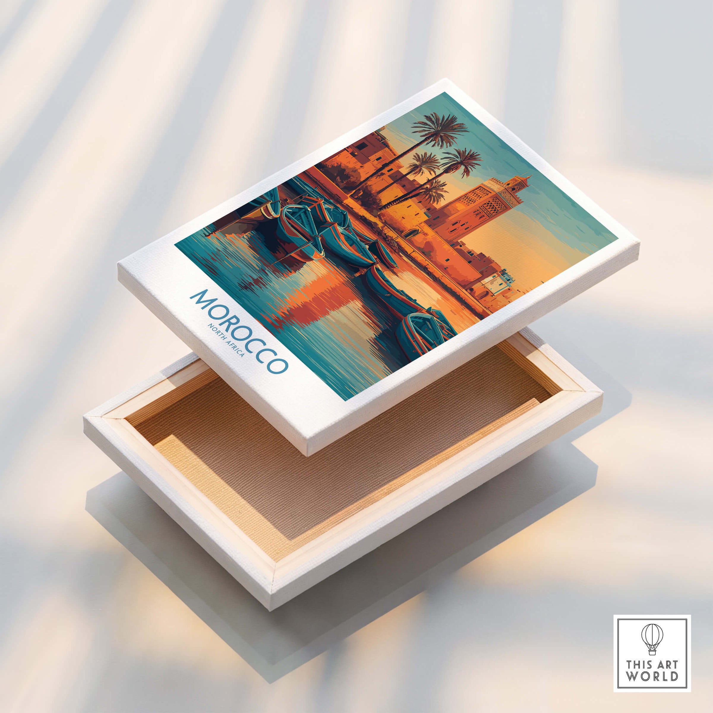 Morocco Canvas Print | Traditional Blue Boat & Port Poster displayed on an art box showcasing vibrant coastal scenery.