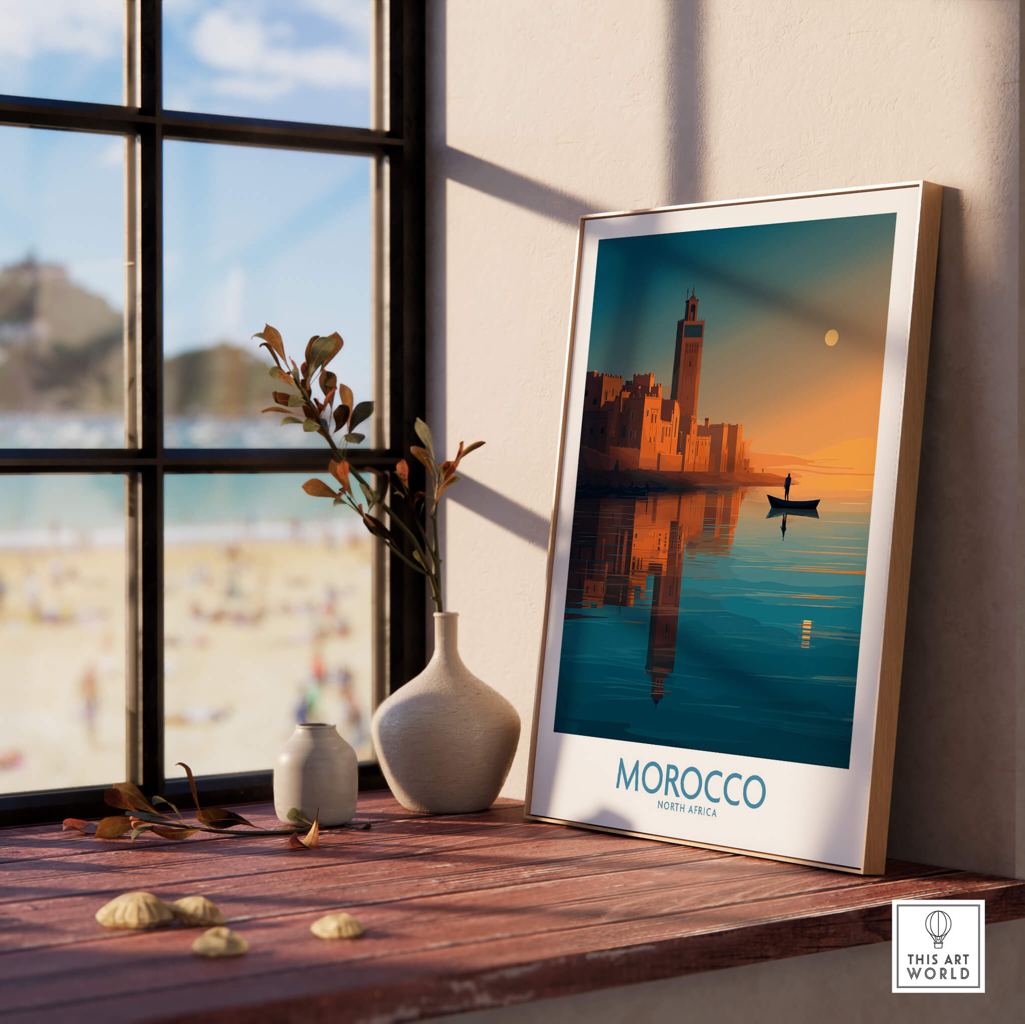 Morocco Poster | North African Cityscape Sunset Canvas Print displayed on a windowsill with a beach view.