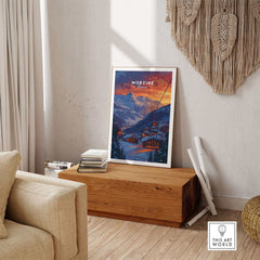 Morzine Print France - Ski poster displayed on wooden bench in cozy room setting with textured wall hanging.