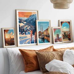 Framed Morzine ski poster wall art print displayed among travel art prints on a shelf.