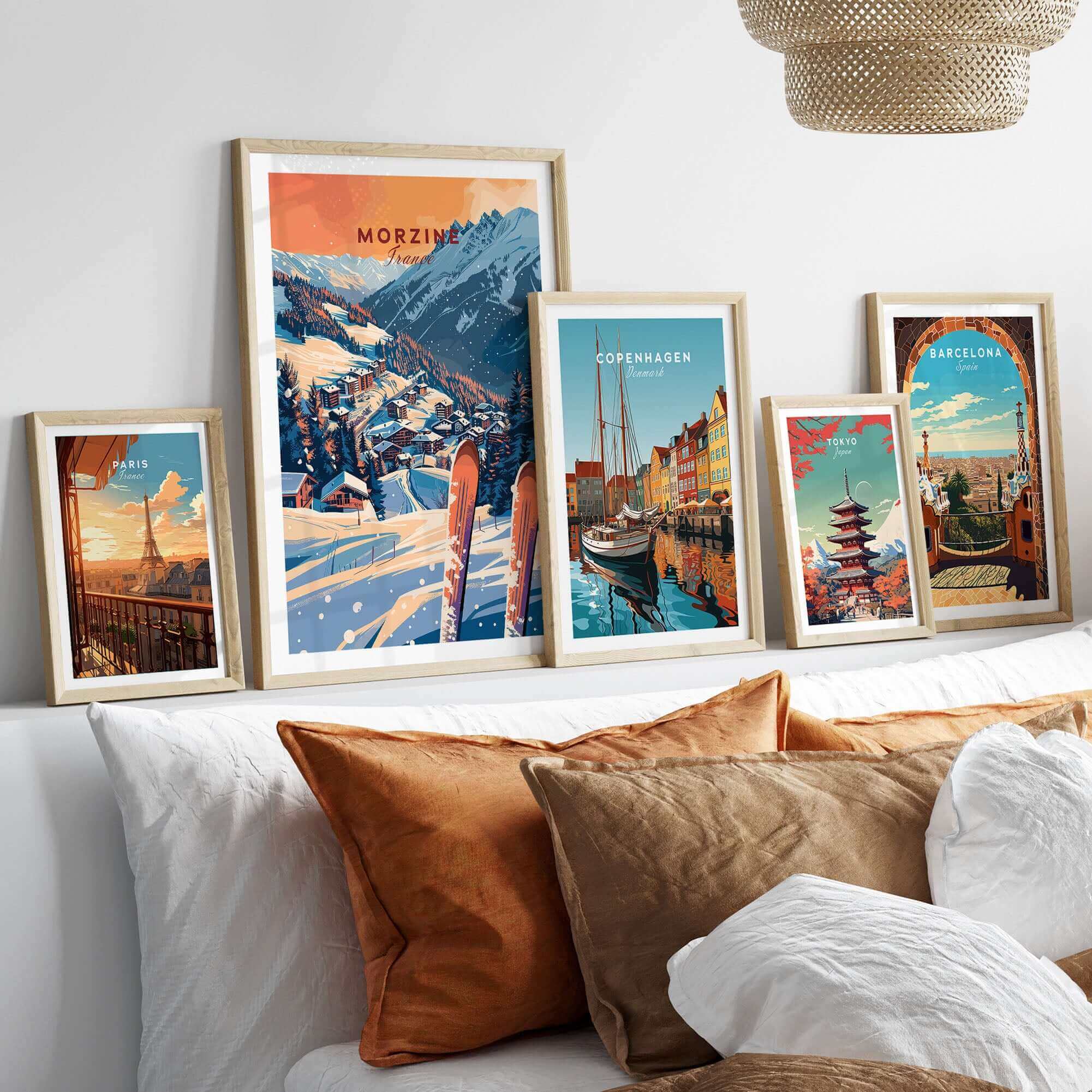 Framed Morzine ski poster wall art print displayed among travel art prints on a shelf.