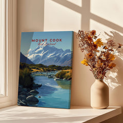 Mount Cook New Zealand Travel Poster | Glacial Lake & Peaks Wall Art Print displayed in a sunlit room.