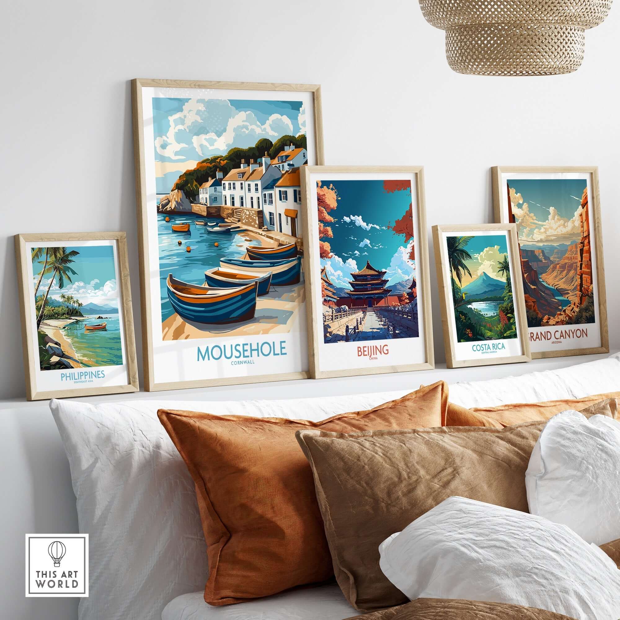 Mousehole Travel Poster Cornwall showcased among other travel posters on a stylish home decor display.