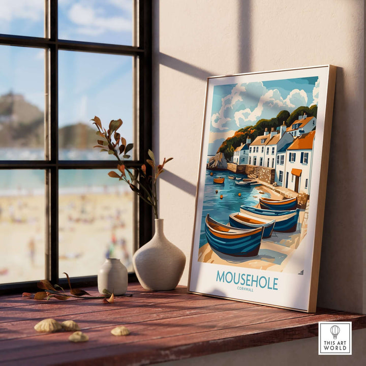 Mousehole Travel Poster Cornwall - colorful fishing village wall art on window sill, capturing coastal beauty for home decor.